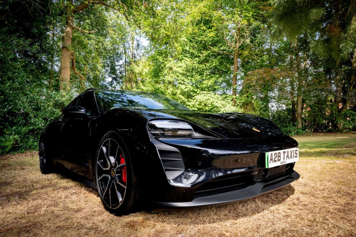 Black Porsche Taycan 4S electric executive hire car in Norwich