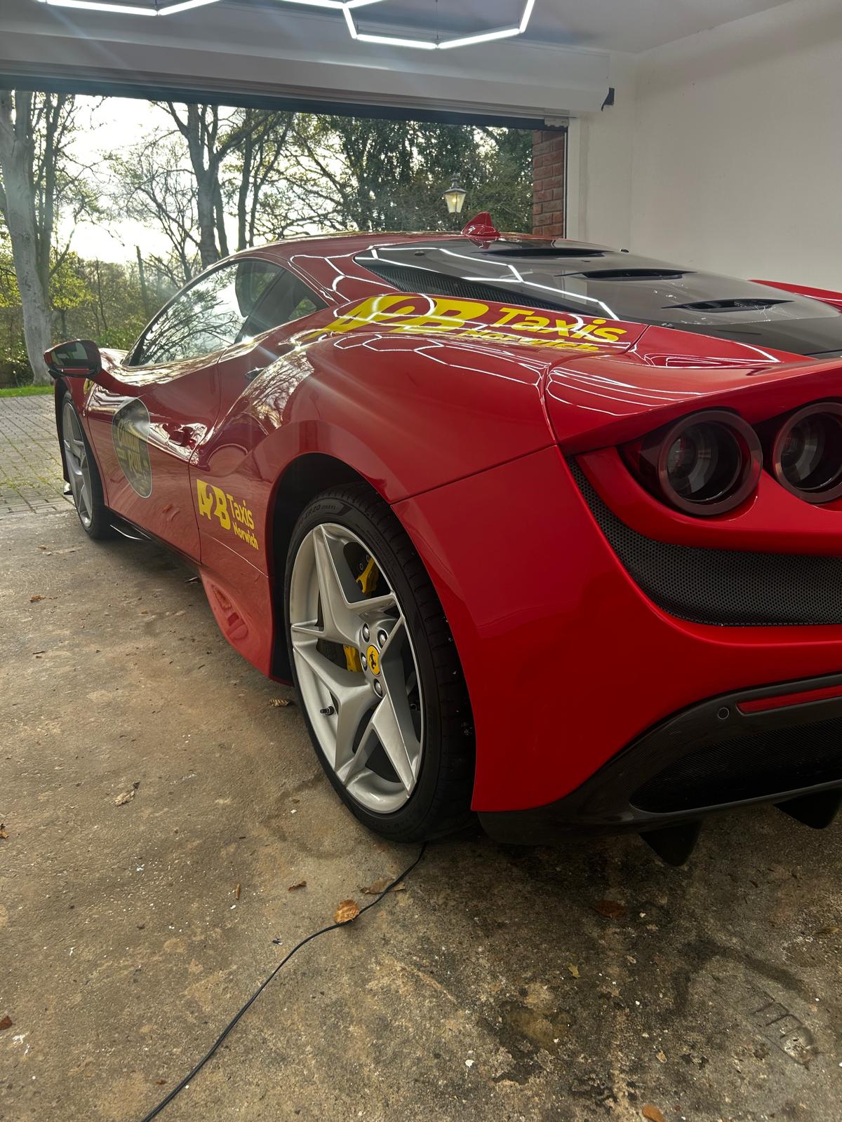Ferrari rear side leaving the garage